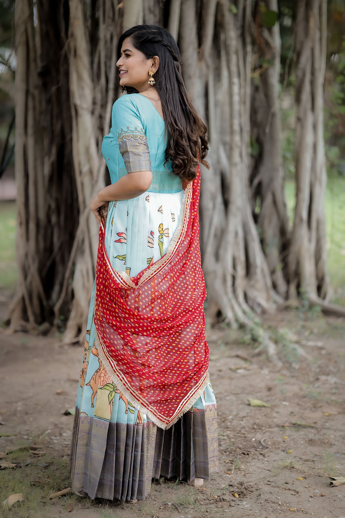 Powder blue kalamkari dress with red dupatta