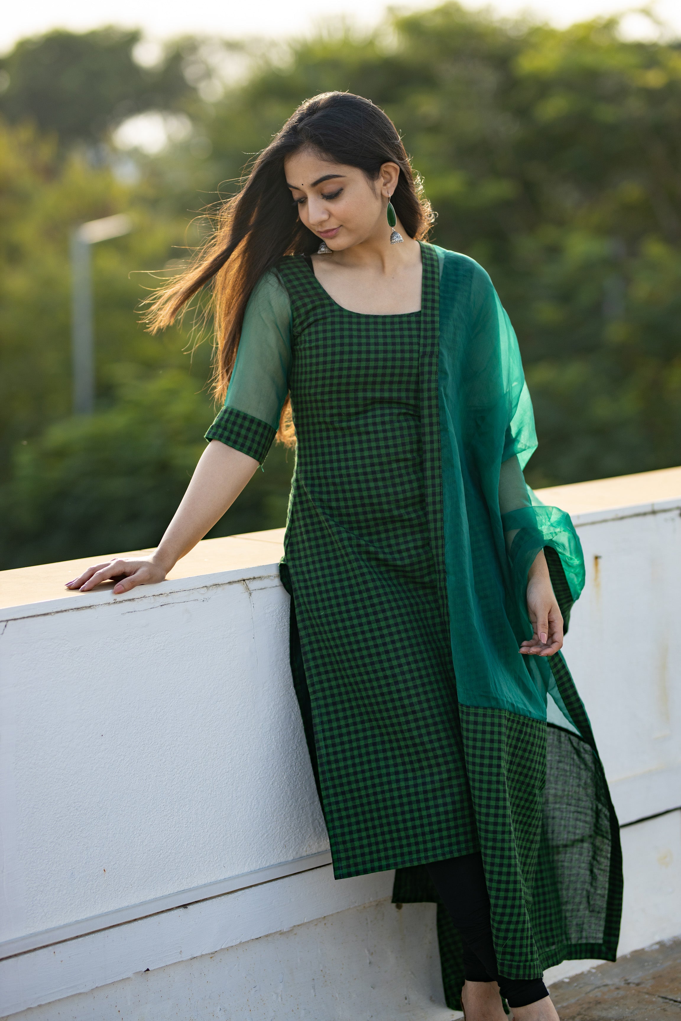 Look stylish in this green cotton kurti for women featuring a straight kurta style, half sleeves, and an organza dupatta. Perfect lightweight kurti for summer.