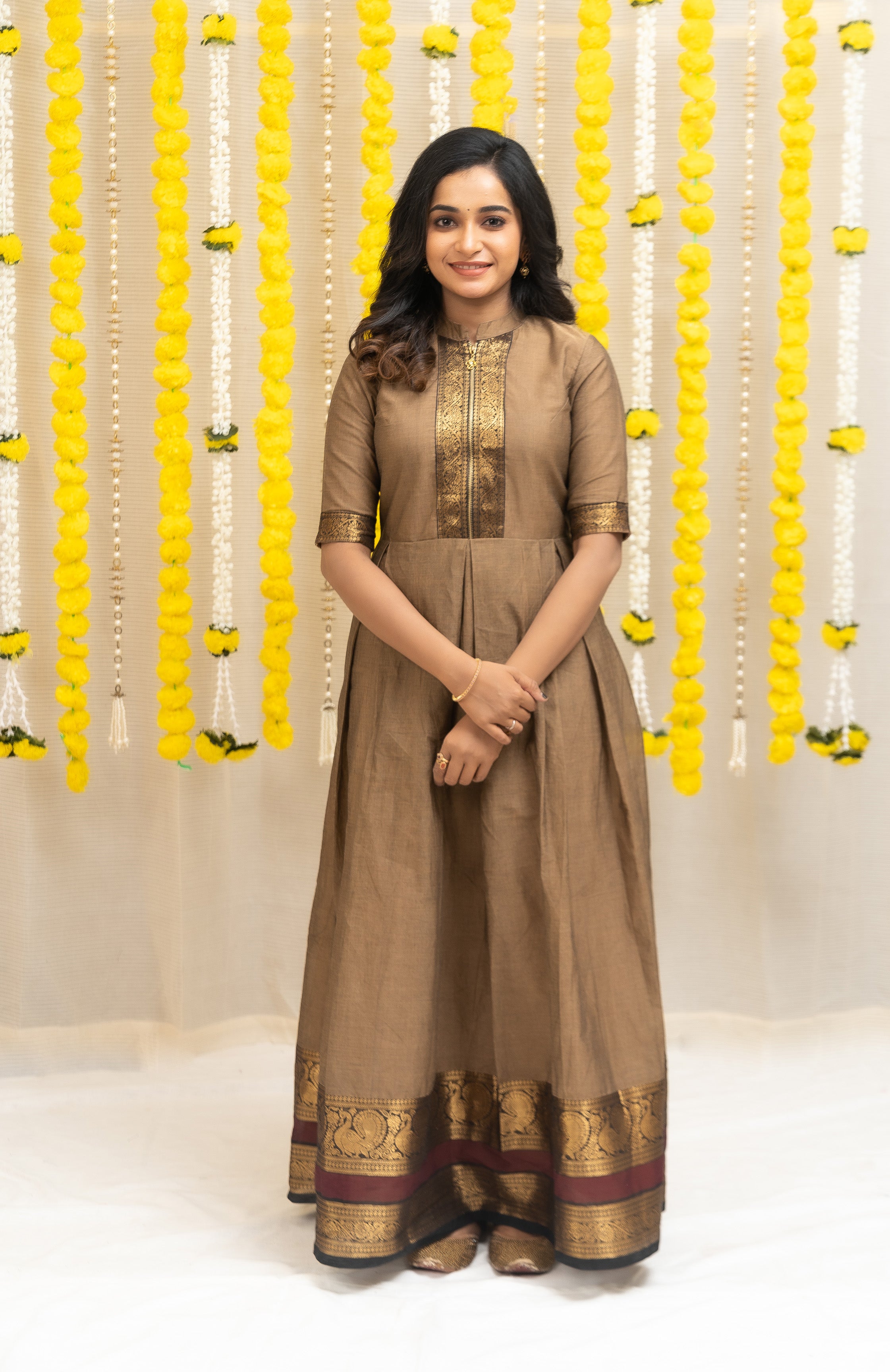 Look stylish in this maternity brown anarkali dress - crafted with Chettinad cotton and contrast trimmings. Get the modern ethnic look with this comfortable and casual simple dress.