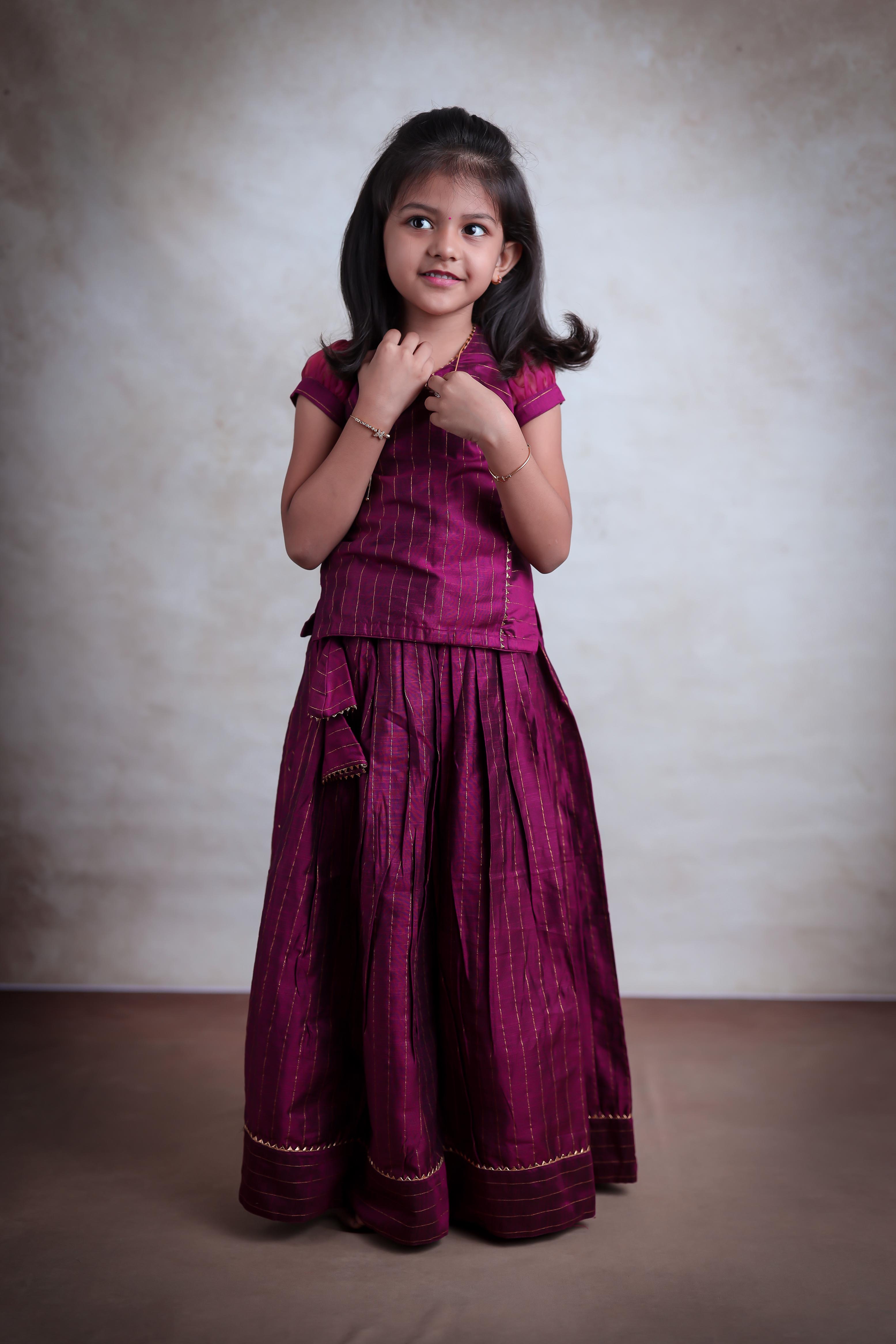 Shop online for readymade Girls Indian Chanderi Skirts-Tops (Pavadai Sattai), made with Organza puff sleeve with pleated skirt and back zipper. Quality silk-cotton fabric for a perfect pick.
