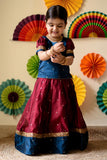 Beautiful handcrafted red and blue pattu pavadai sattai for baby girls. Made of fine Indian silk cotton, this traditional newborn dress is perfect for special occasions.