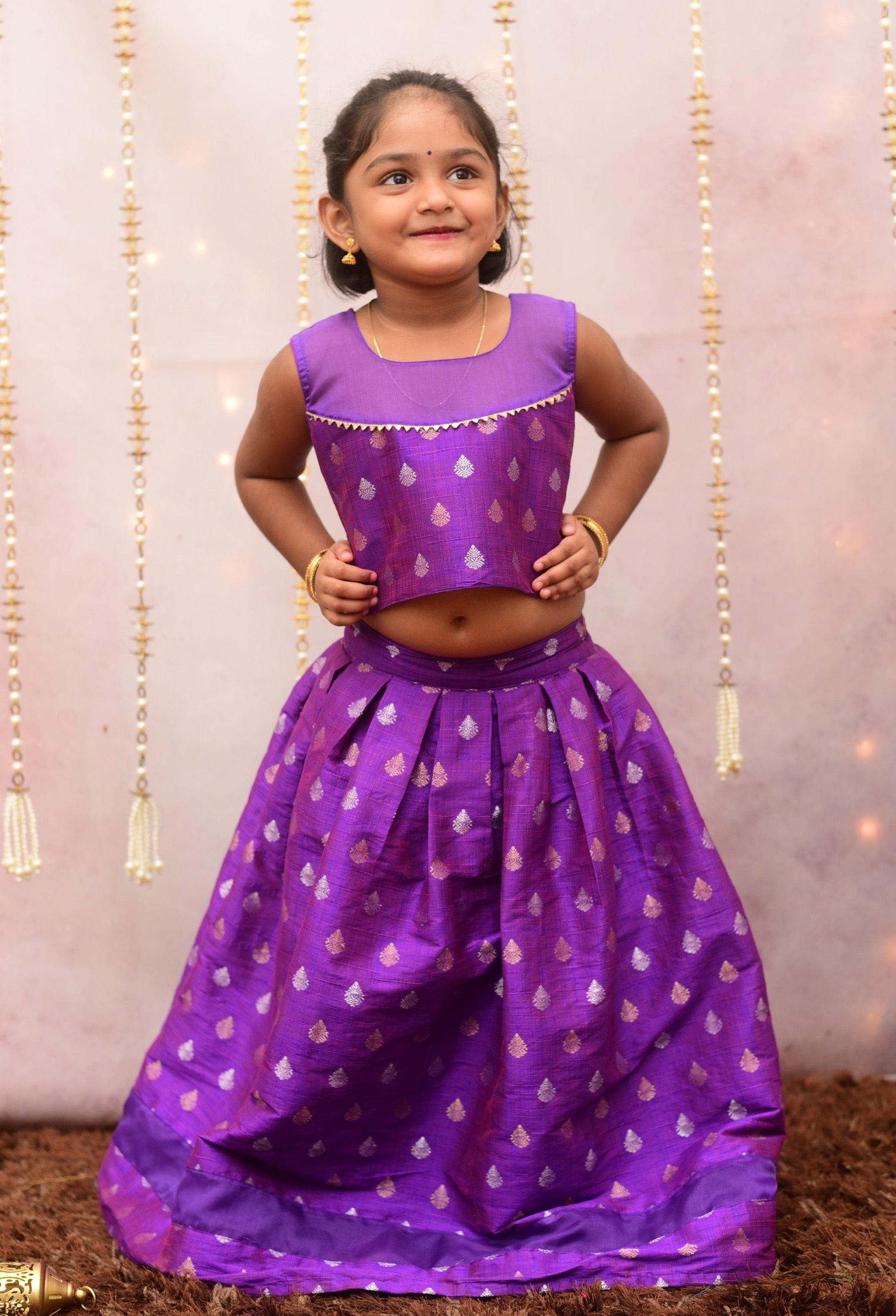 Shop for quality mommy and me Indian dresses for kids. Shop for branded kidswear online, featuring stylish brocade pattu top and skirt sets in vibrant shades of violet with beautiful soft organza borders.