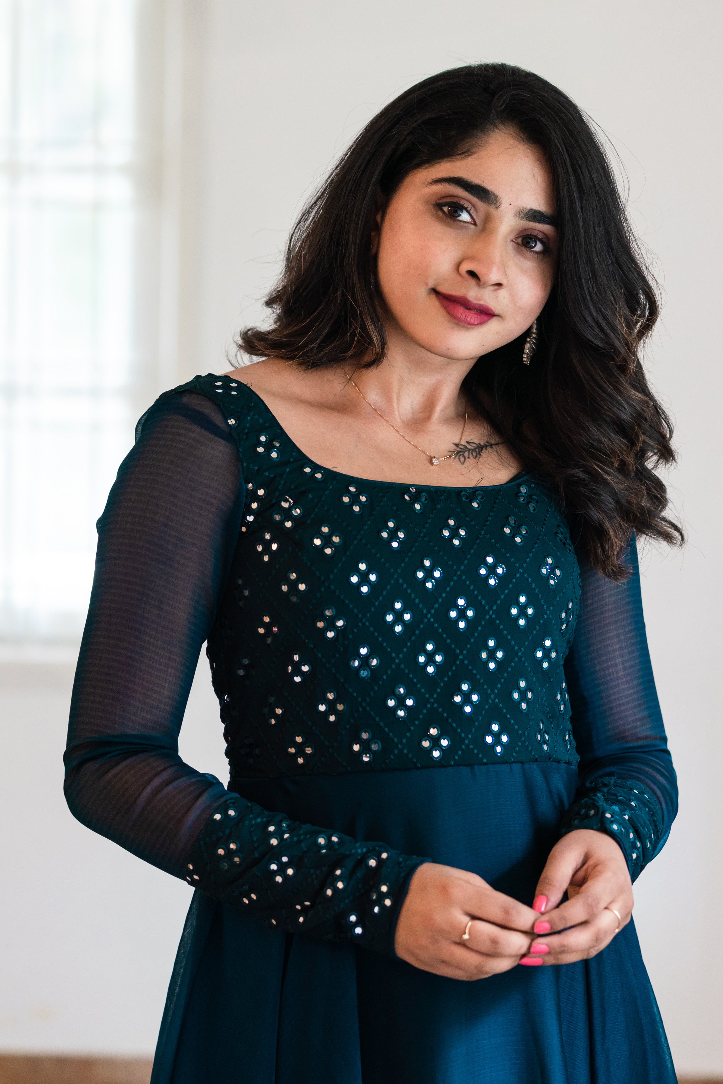 Stand out with our unbeatably stylish dark green mirror embroidered georgette long dress. Perfect for any occasion, this Indo-Western maxi dress is sure to make you the center of attention.